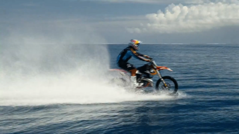 Motocross star surfs big waves on his bike
